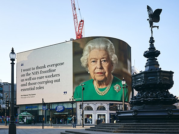 Piccadilly Circus billboard showing an advert from the Queen thanking the NHS